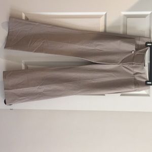 Beige pinstripe pants.